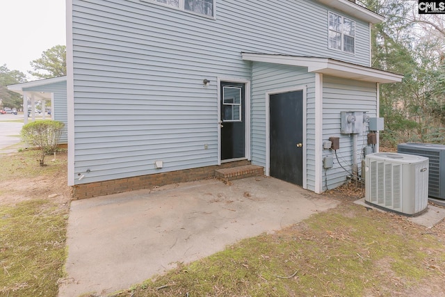 exterior space with a patio and central AC unit