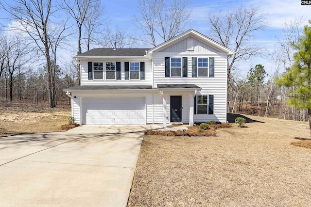 traditional-style house featuring a garage, board and batten siding, and concrete driveway