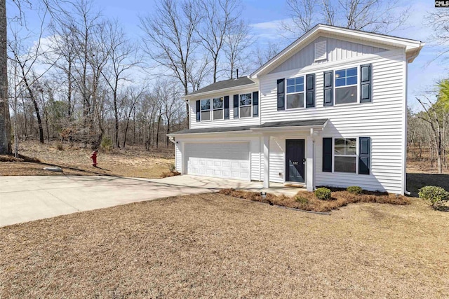 traditional-style house with concrete driveway, board and batten siding, and an attached garage