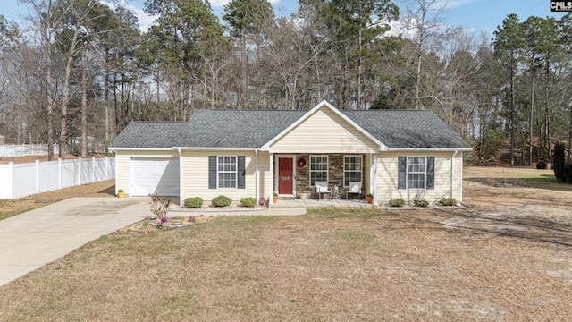 single story home with a shingled roof, fence, driveway, and a front lawn