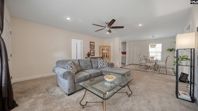 carpeted living area with baseboards, a ceiling fan, and recessed lighting