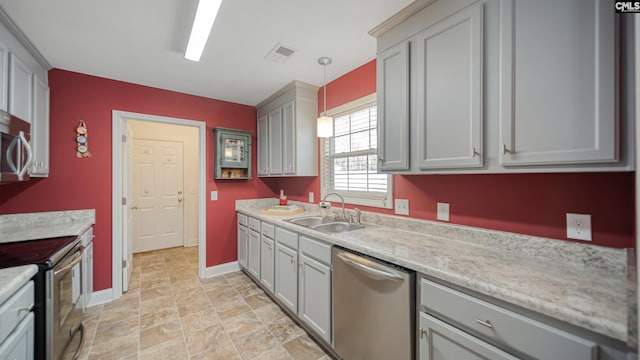 kitchen featuring a sink, visible vents, light countertops, appliances with stainless steel finishes, and gray cabinets