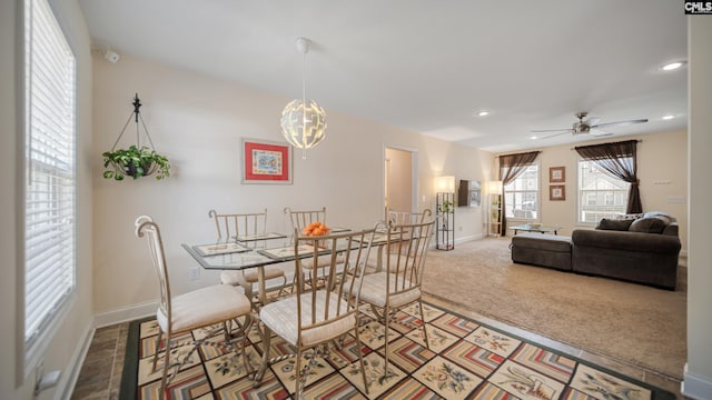 dining room featuring ceiling fan with notable chandelier, carpet, baseboards, and recessed lighting