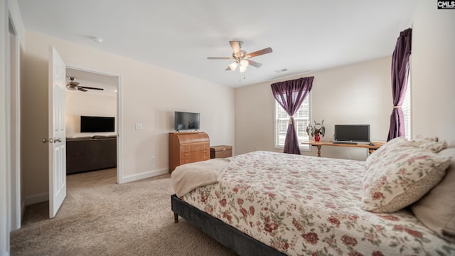 carpeted bedroom featuring a ceiling fan, visible vents, and baseboards