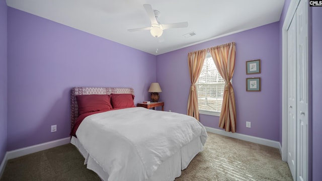 bedroom with baseboards, visible vents, and carpet flooring