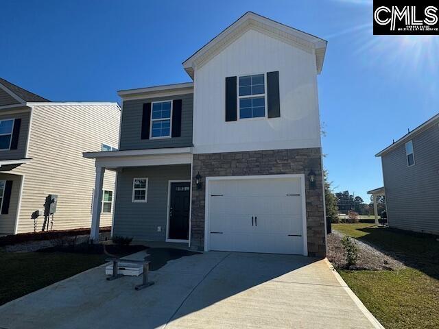 view of front of property with a garage, concrete driveway, and stone siding