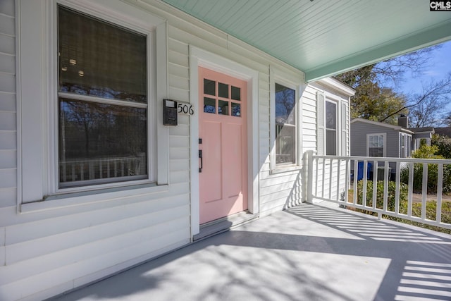 property entrance featuring covered porch