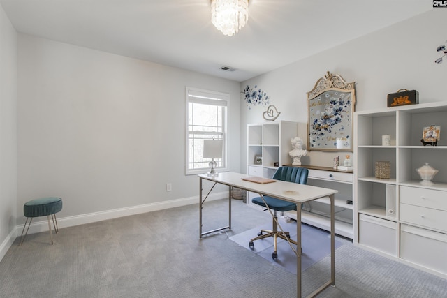 office area with a chandelier, baseboards, visible vents, and carpet flooring