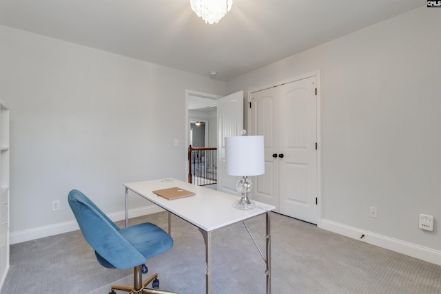 office featuring light carpet and baseboards