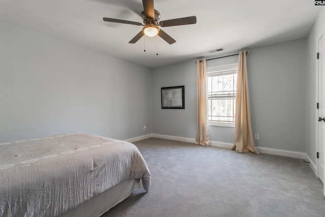 carpeted bedroom with ceiling fan, visible vents, and baseboards