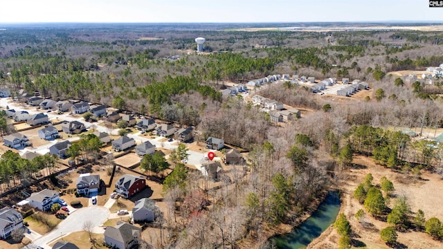 birds eye view of property with a residential view and a view of trees