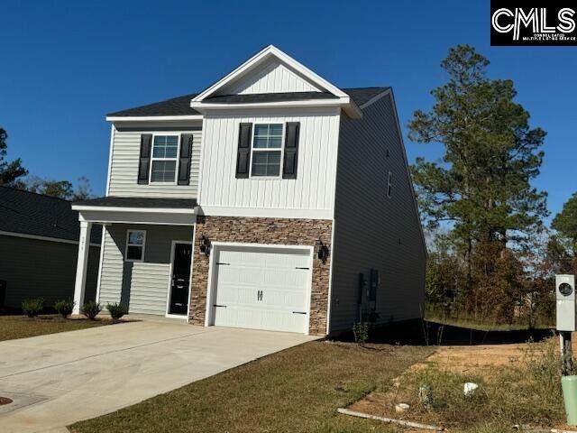 view of front of property with a garage, stone siding, board and batten siding, and concrete driveway