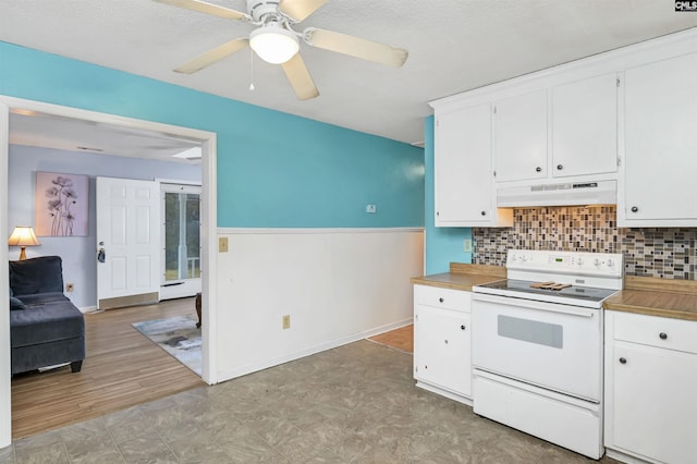 kitchen with white electric stove, ceiling fan, under cabinet range hood, white cabinetry, and backsplash