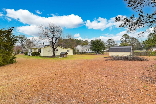 view of yard with a shed and an outdoor structure