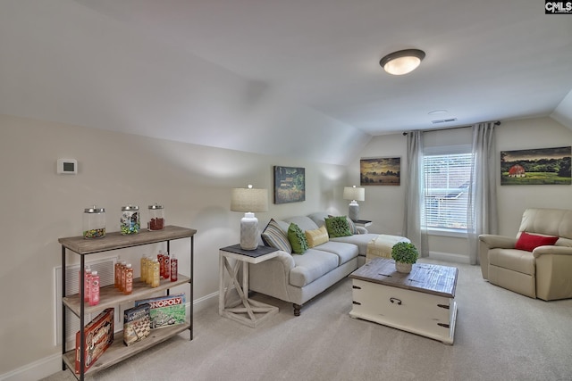 carpeted living area featuring vaulted ceiling, visible vents, and baseboards