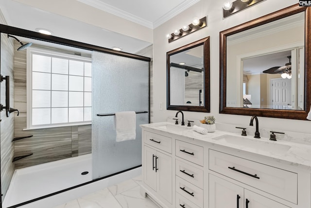 full bathroom with a tile shower, marble finish floor, ornamental molding, and a sink
