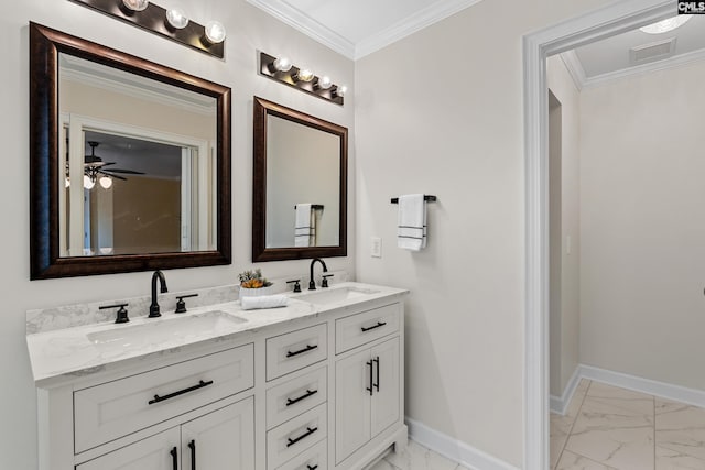 full bathroom with crown molding, marble finish floor, a sink, and baseboards