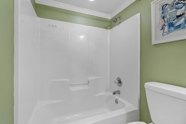 full bathroom with shower / bathtub combination, toilet, and crown molding