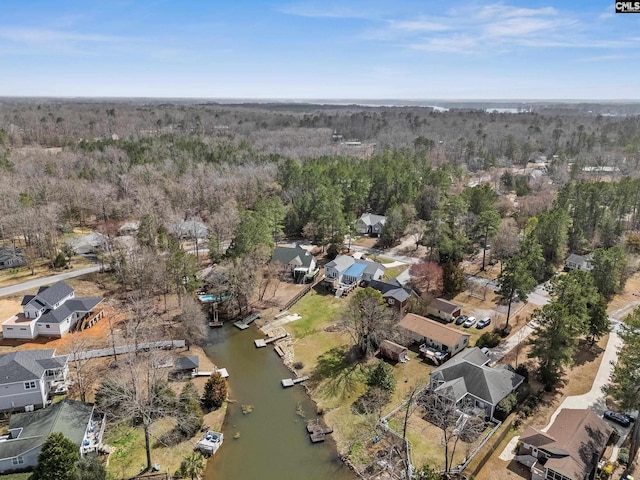 drone / aerial view featuring a residential view and a water view