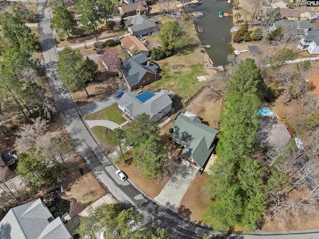 birds eye view of property with a residential view