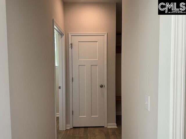 corridor featuring wood finished floors