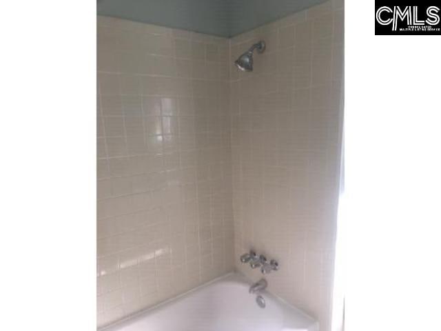 bathroom with shower / bath combination