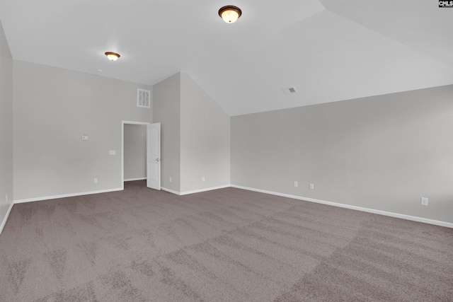 additional living space with lofted ceiling, carpet flooring, visible vents, and baseboards