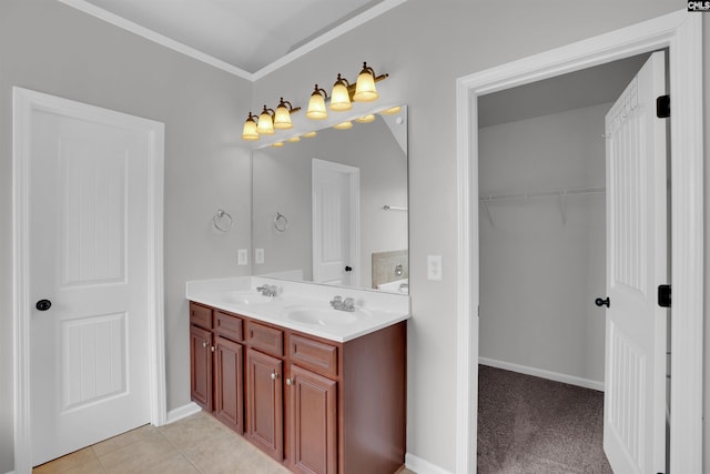 full bathroom featuring double vanity, tile patterned flooring, a walk in closet, and a sink