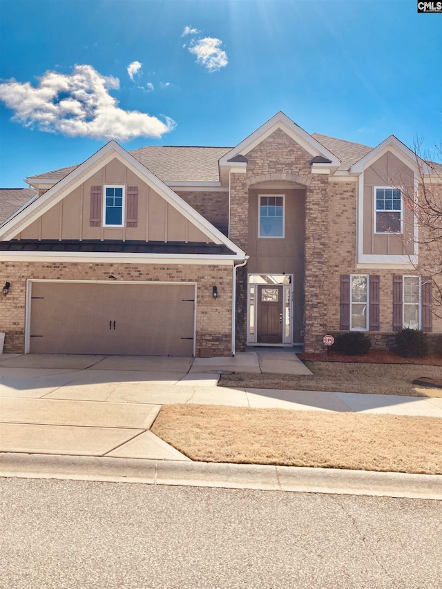 view of front of house with brick siding, board and batten siding, concrete driveway, and a garage