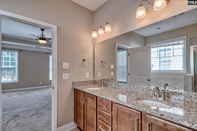 full bathroom featuring plenty of natural light, a ceiling fan, and a sink