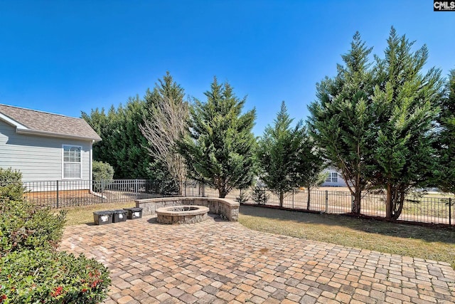 view of patio / terrace featuring fence private yard and an outdoor fire pit