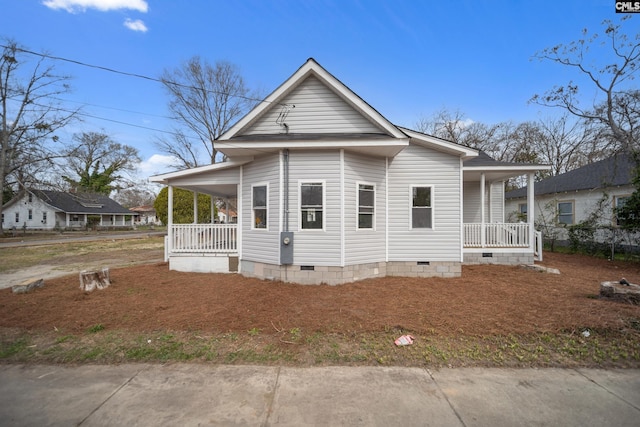 view of front of house featuring covered porch and crawl space