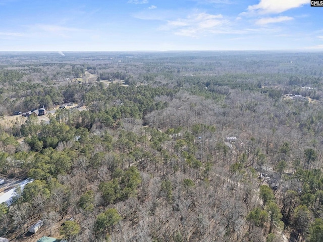 birds eye view of property with a wooded view