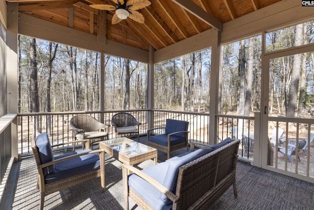 sunroom / solarium featuring vaulted ceiling and ceiling fan