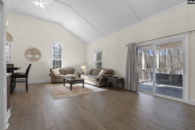 living area featuring high vaulted ceiling, dark wood-style flooring, ceiling fan, and baseboards