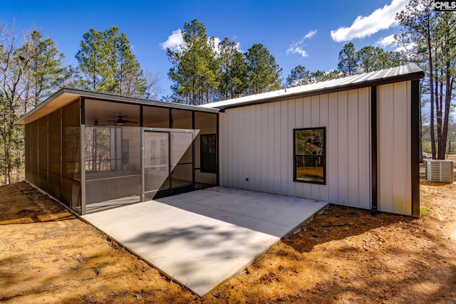 exterior space with cooling unit and a sunroom