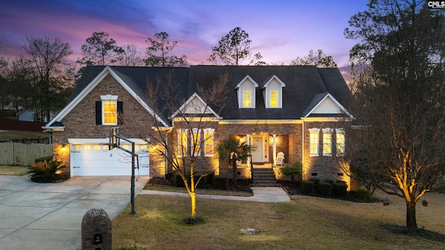 view of front of home featuring concrete driveway, brick siding, crawl space, and fence