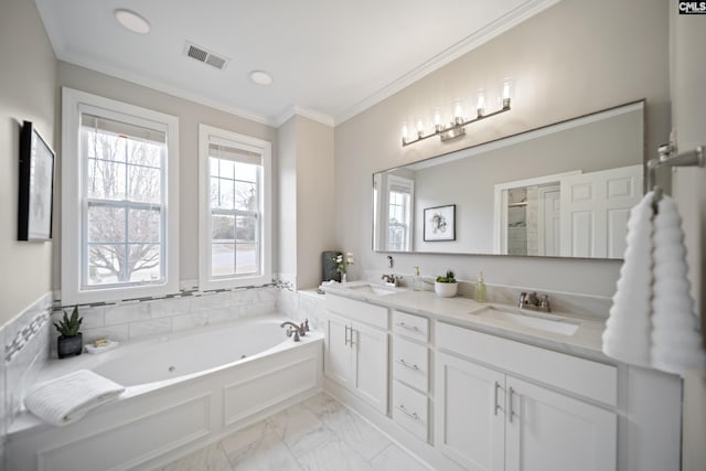 bathroom featuring a bath, ornamental molding, a sink, and visible vents