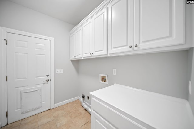 laundry room featuring cabinet space, hookup for a washing machine, and baseboards