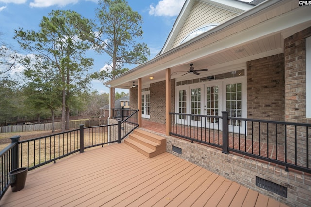 wooden deck featuring a ceiling fan and french doors