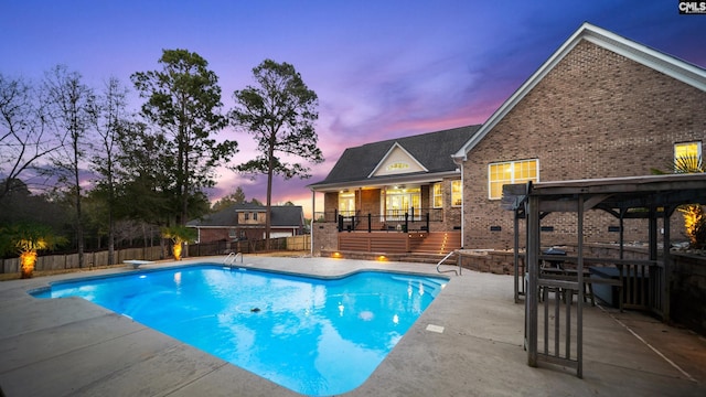 view of pool with a wooden deck, a patio, a fenced backyard, and a fenced in pool