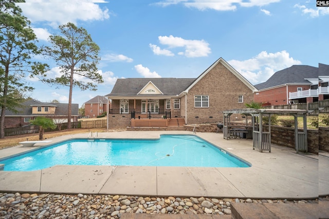 view of swimming pool with a patio area, a fenced in pool, fence, and a pergola