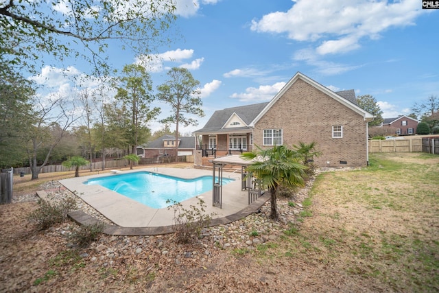 view of pool with a patio, a fenced backyard, a diving board, a yard, and a fenced in pool