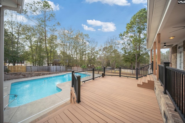 view of pool with ceiling fan, a deck, a fenced backyard, and a fenced in pool