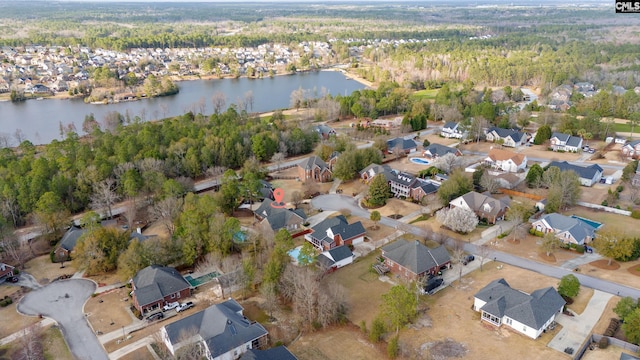 birds eye view of property with a water view and a residential view