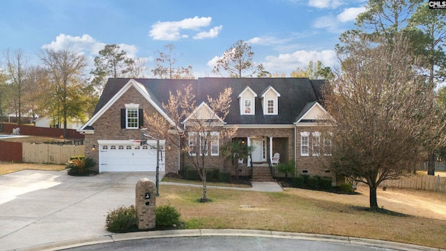 view of front of house featuring driveway, brick siding, crawl space, fence, and a front yard