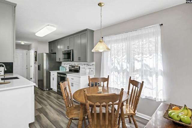 dining area with dark wood finished floors