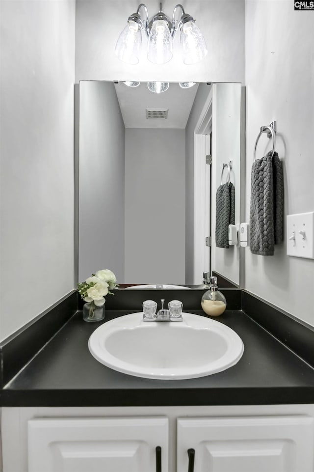 bathroom featuring visible vents and vanity