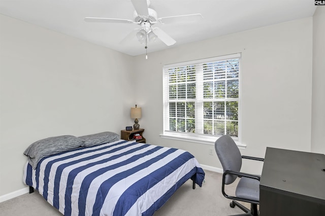 carpeted bedroom featuring ceiling fan and baseboards