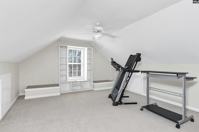 exercise area with carpet, baseboards, vaulted ceiling, and a ceiling fan